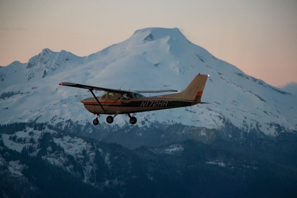 Cessna N172HR in flight over the Cascades at sunset